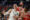 El alero del Real Madrid Mario Hezonja (i) pelea la posición con Nikola Mirotic, del Olimpia, durante el partido de la EuroLiga de baloncesto que Real Madrid y Olimpia Milano disputaron en el Movistar Arena. EFE/Juanjo Martín