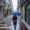 Una mujer con paraguas se protege de la lluvia este viernes en el carrer Nou del centro histórico de Mahón, Menorca. EFE/ David Arquimbau Sintes