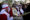 Dos fieles católicos cargan la imagen de Jesús durante la procesión de Las Palmas este domingo en el poblado indígena de San Pedro Sacatepéquez en el oeste de Guatemala. EFE/David Toro
