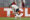 Lucas Cepeda de Colo Colo recoge objetos lanzados por aficionados al campo en un partido de la fase de grupos de la Copa Libertadores. EFE/ Osvaldo Villarroel