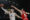 El alero bosnio del Real Madrid, Dzanan Musa (i), con el balón ante el ala pivot de Olympiacos, Kostas Papanikolau, durante el encuentro correspondiente al playoff de la Euroliga que disputaron Real Madrid y Olympiacos en el Movistar Arena, en Madrid. EFE / Sergio Pérez.