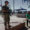 Un miembro del Ejército paraguayo (i) fue captado este viernes, 2 de mayo, al custodiar la segunda misión del buque hospital 'Capitán Carlos Cubas', en la fronteriza localidad de Bahía Negra (Paraguay). EFE/Juan Pablo Pino
