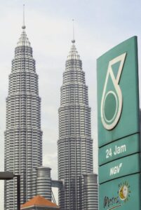 epa000223999 A view of Petronas logo billboards against the building of Petronas Towers in Kuala Lumpur, Thursday, 01 July 2004. Malaysian oil firm Petronas said on Wednesday, 30 June, net profit in the year to March 2004 rose 57 percent due to higher crude oil prices and operational improvements. EPA/AHMAD YUSNI