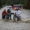 Fotografía de archivo de un grupo de personas al cruzar con dificultad una carretera inundada, producto de las intensas lluvias, en San José de Ocoa (República Dominicana). EFE/Orlando Barría
