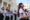 Niños sostienen fotos del papa y cantan canciones este viernes frente a la iglesia Santa María Catedral de Chiclayo (Perú). EFE/Paolo Aguilar