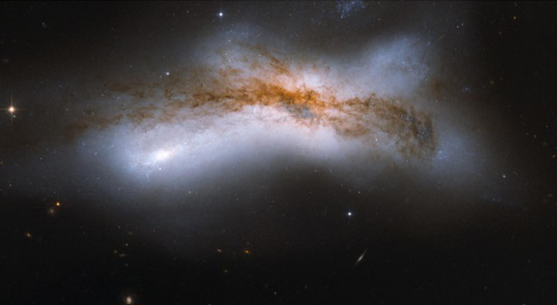 Representación artística de la Vía Láctea y la galaxia de Andrómeda en colisión. Crédito:NASA, ESA