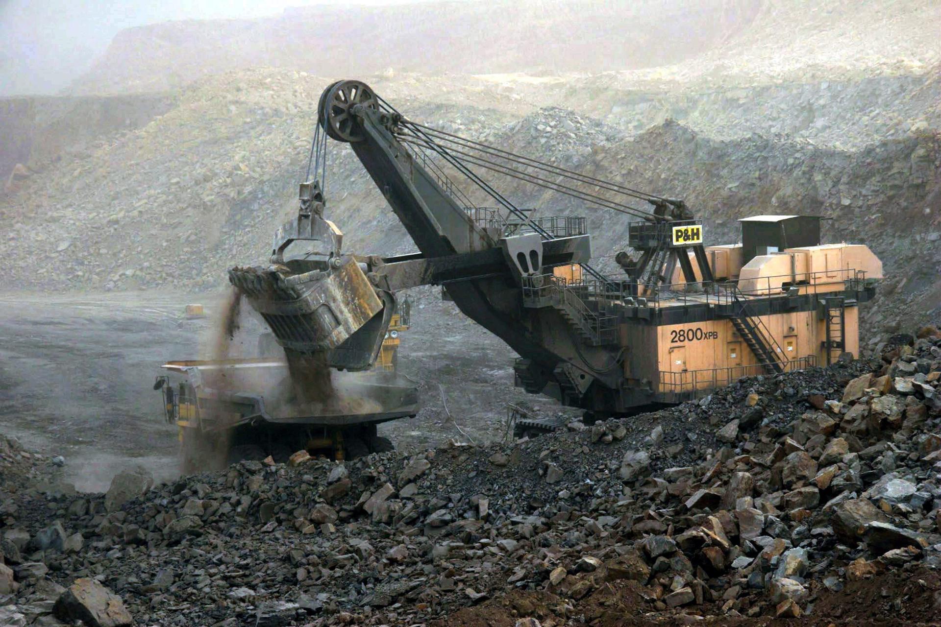 ARCHIVE - epa03086902 (FILE) A file photo dated 07 July 2005 showing an earth digger dumping dirt on to a large truck at the Antaibao open-air coal mine near Shuozhou, Shanxi Province, China. Geneva-based World Trade Organization (WTO) dismissed a Chinese appeal on 30 January 2012 and upheld its decision that Beijingís practice of limiting certain raw materials including magnesium should end. Western countries that won the trade dispute over Chinese export restrictions on industrial raw materials, have already set their sights on a new goal: prying open Beijing's restrictive policies on rare earths. However, China is unlikely to budge on these minerals, now sought after by high-tech industries, unless there is a specific new ruling by the World Trade Organization (WTO), expert Jaakko Kooroshy said 31 January 2012. EPA/QILAI SHEN