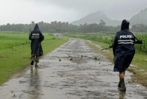 Archive. NW015. Rathedaung (Myanmar), 26/08/2017.- Myanmar police officers in rain coats patrol on a road in the etnic Rakhine village of ChainKharLi, an area close to fighting at Rathedaung township of northern Rakhine State, western Myanmar, 26 August 2017. According to a statement by the Myanmar Armed Forces, at least 32 people, including eleven law enforcement officials, were killed on 25 August in Myanmar after Rohingya militants attacked police outposts and an army base in the western state of Rakhine. (Birmania, Atentado) EFE/EPA/NYUNT WIN